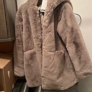 Beautiful apparis fur coat never worn.